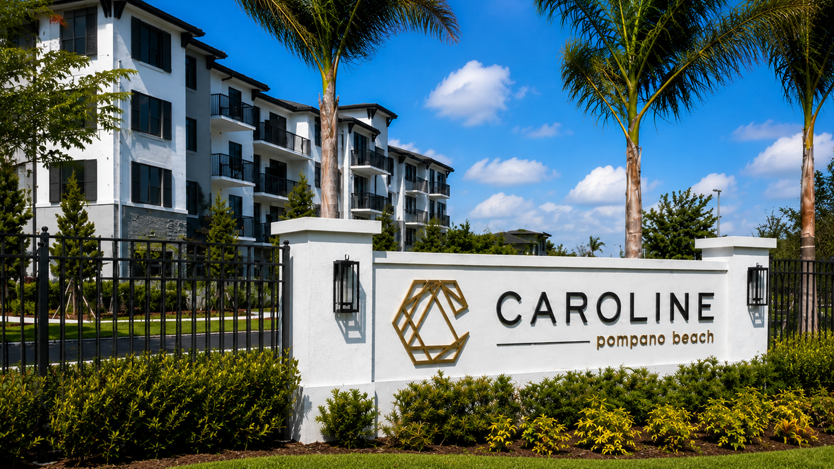 Luxurious Caroline Pompano Beach apartments surrounded by lush greenery and elegant palm trees, offering modern living in a serene setting.