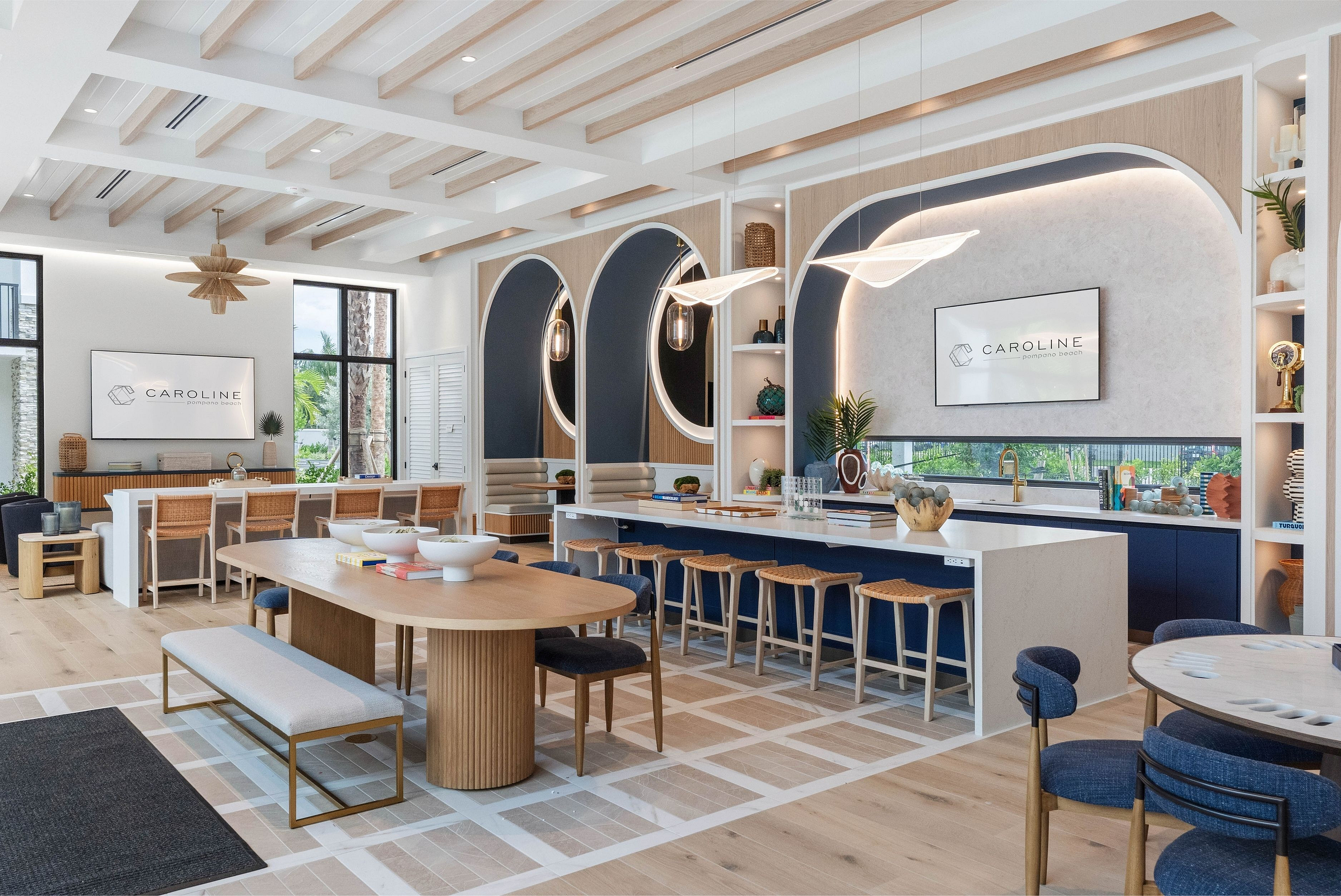 Chic and modern communal area with stylish seating, elegant lighting, and wooden accents offering a welcoming atmosphere.