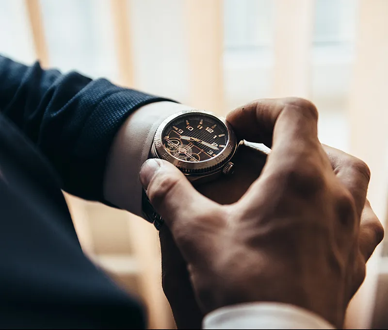 Close-up of a classic wristwatch with an elegant design and detailed dial.