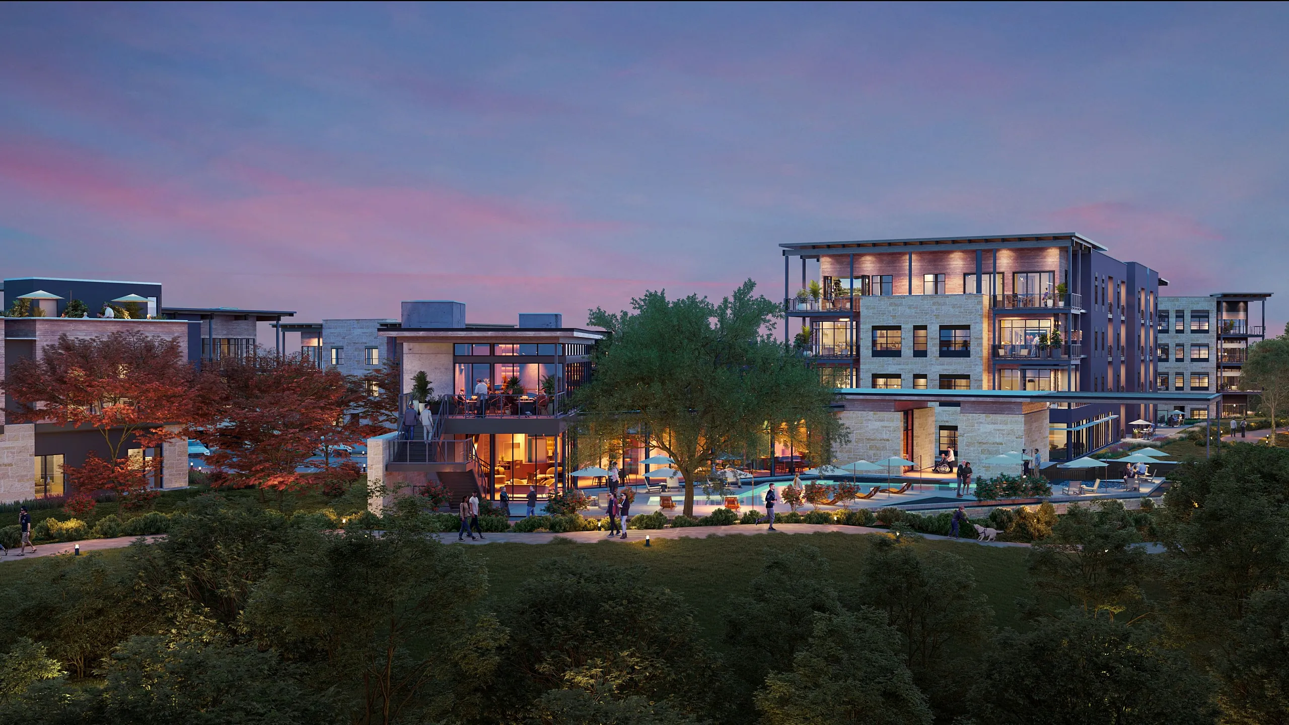 Luxurious modern apartment complex at dusk featuring elegant architecture, vibrant outdoor terraces, and lush greenery.