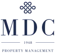 Elegant MDC Property Management logo featuring a sophisticated emblem and bold text emphasizing trust and reliability since 1948.