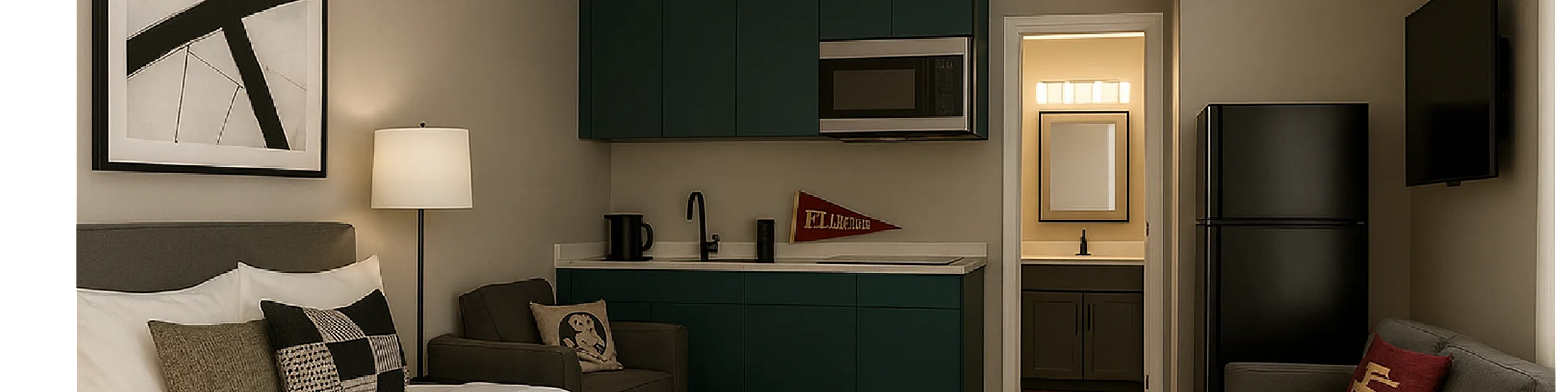 Chic studio apartment featuring a cozy bed, modern kitchenette, and stylish decor with a bright, welcoming atmosphere.