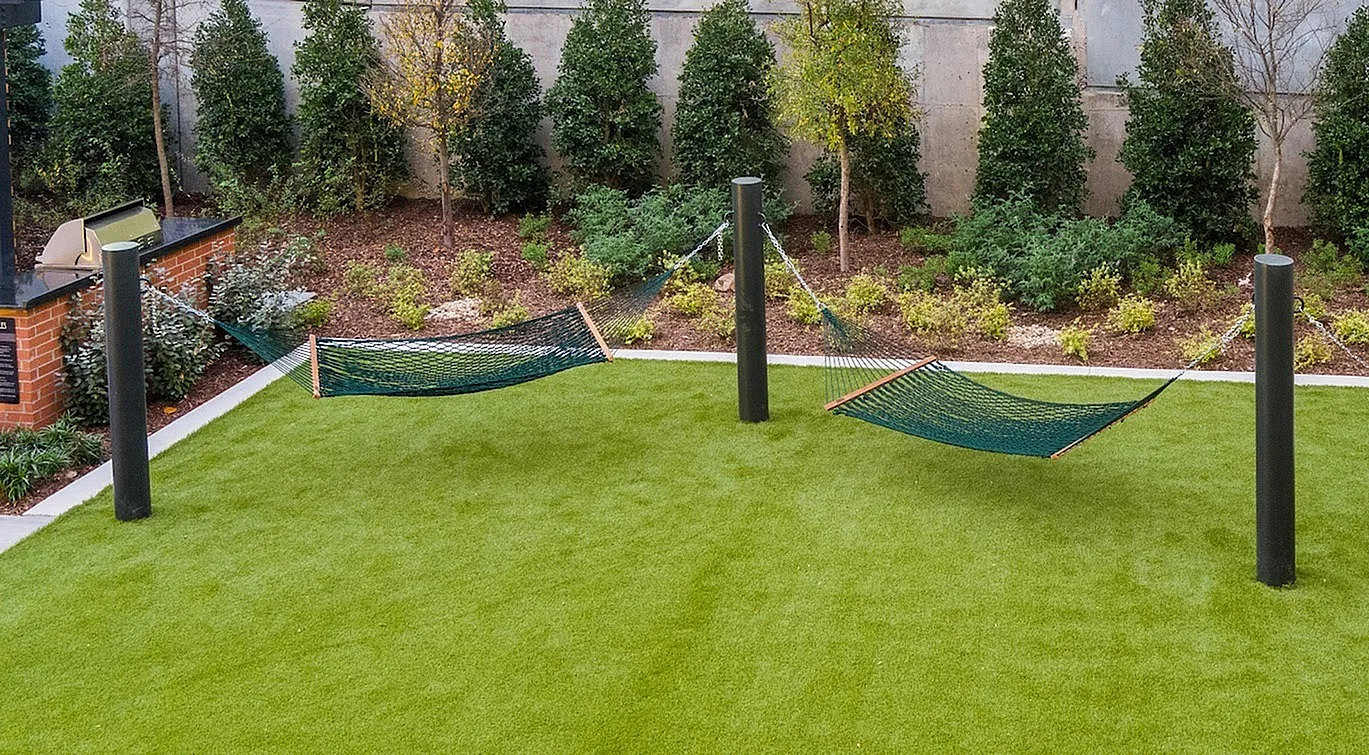 Peaceful Hammocks on lush green courtyard | Apartments for rent in Plano, TX | The Emory