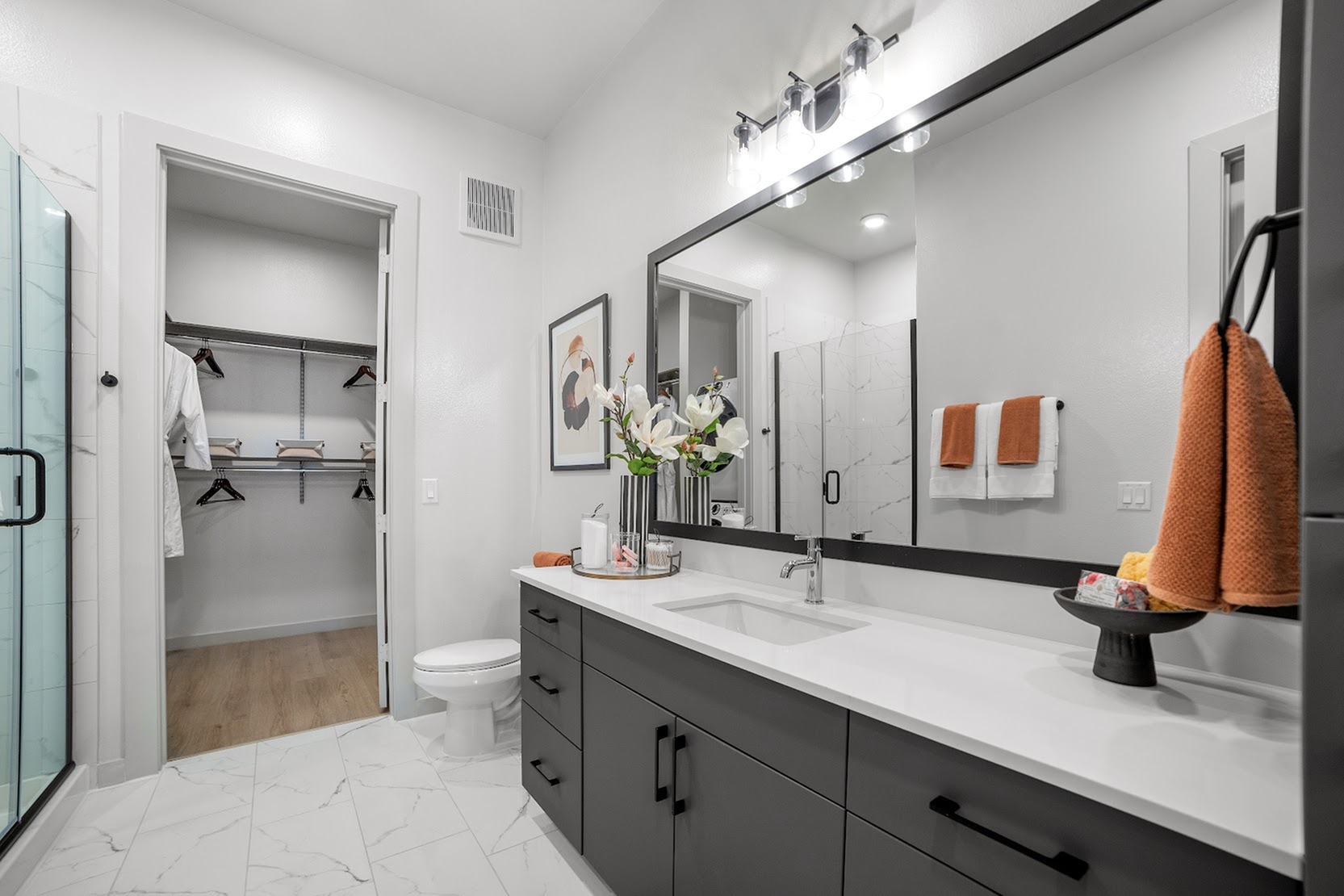 Bluebonnet A bathroom with a large vanity, lots of storage and modern shower