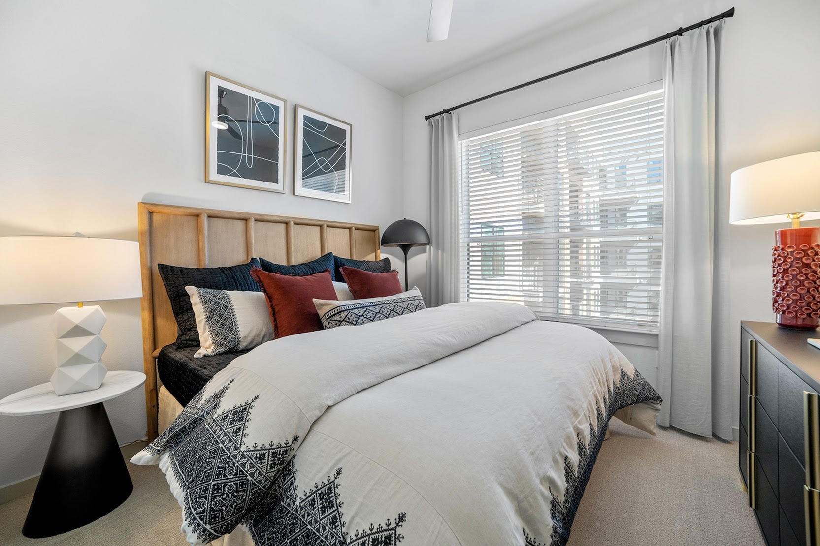 Bluebonnet A bedroom with ceiling fan and large window with natural light