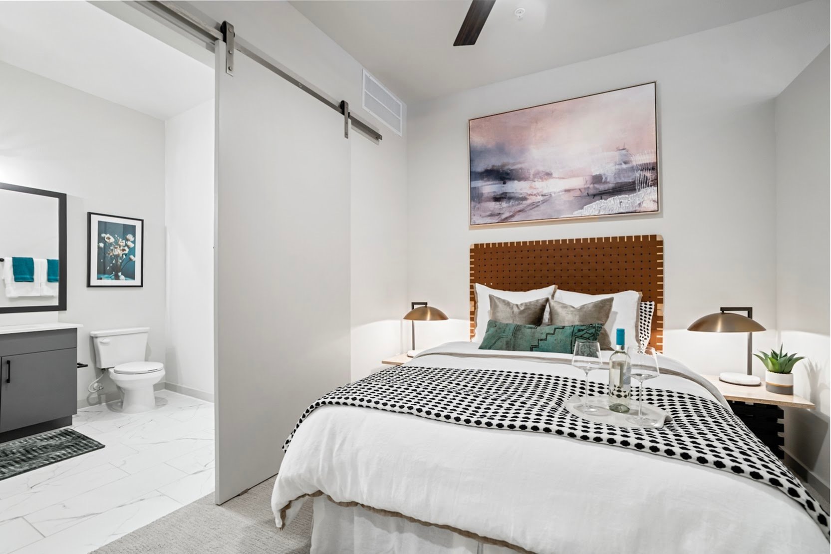 Santa Fe A bedroom with adjacent stylish bathroom