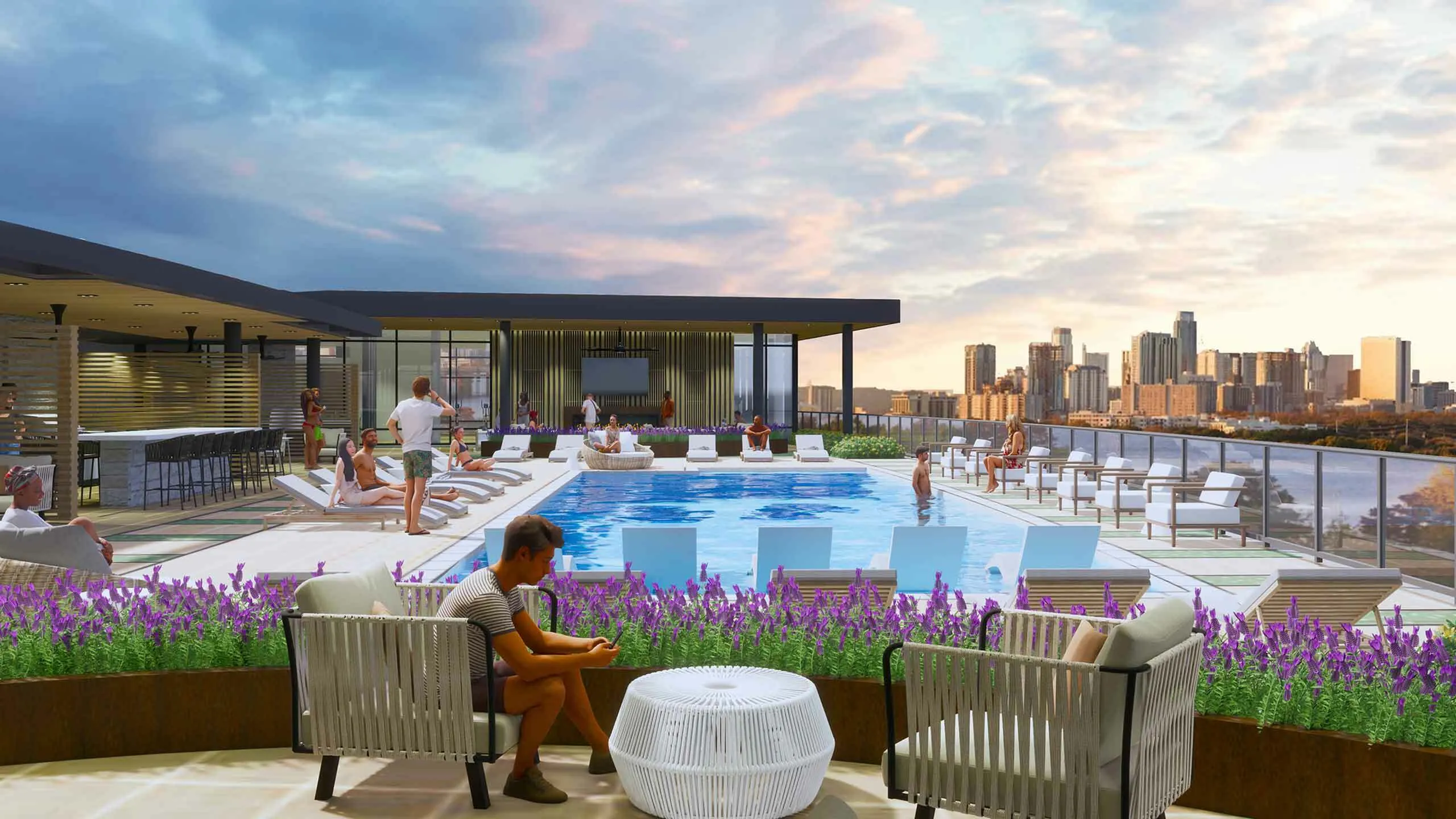 Luxurious rooftop pool area with modern lounge seating and panoramic city skyline views at sunset, perfect for relaxation and entertainment.