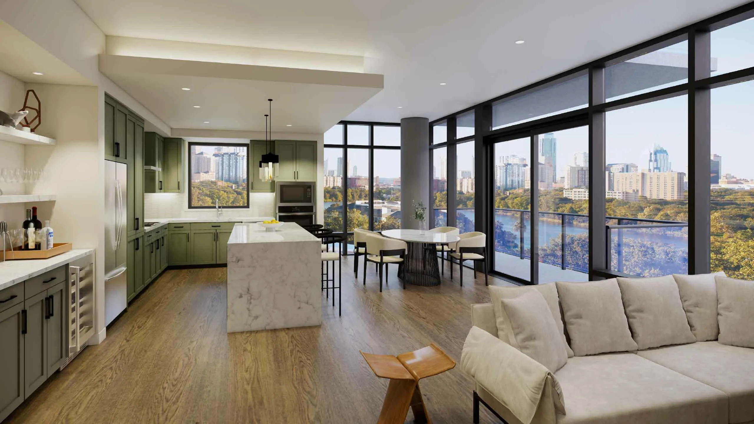 Luxurious open-concept living space featuring a modern kitchen with sleek green cabinets, elegant marble island, and stunning floor-to-ceiling windows offering breathtaking city and lake views.
