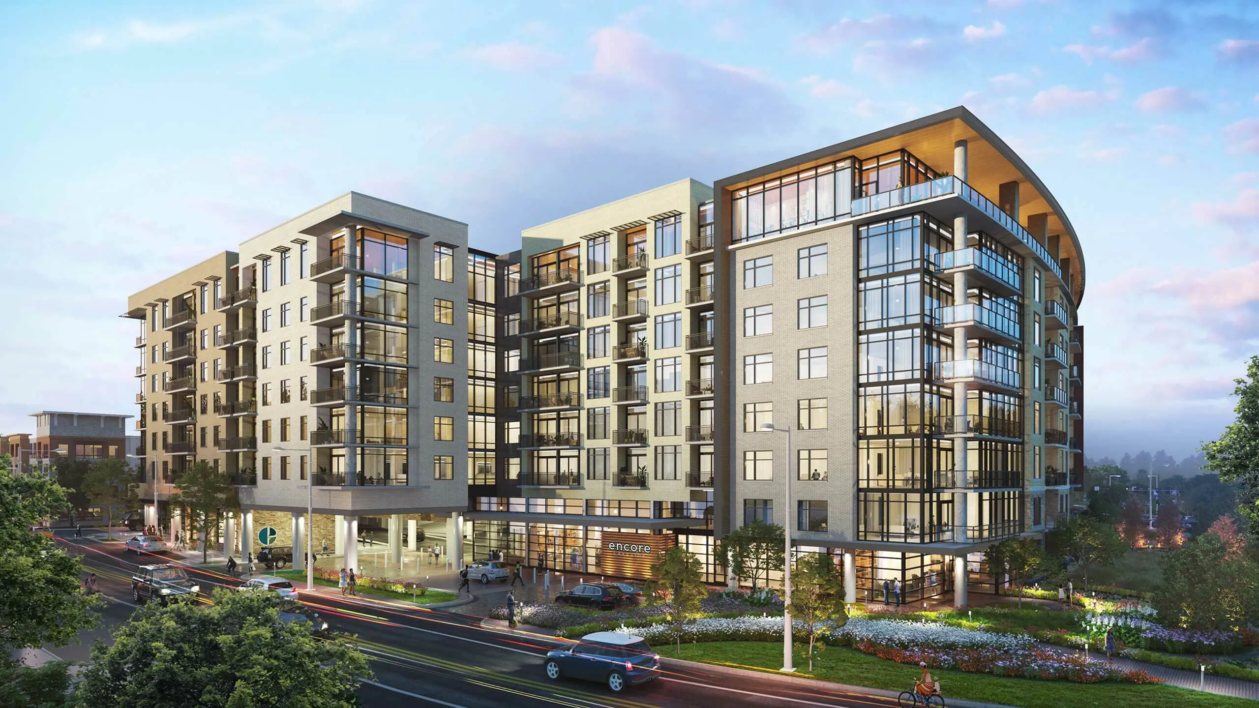 Chic modern apartment building with expansive glass windows and lush landscaping, offering luxury high-rise living at its finest.