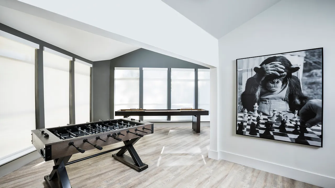 Resident Lounge with Foosball and Shuffleboard at Autumn Columbia apartments.