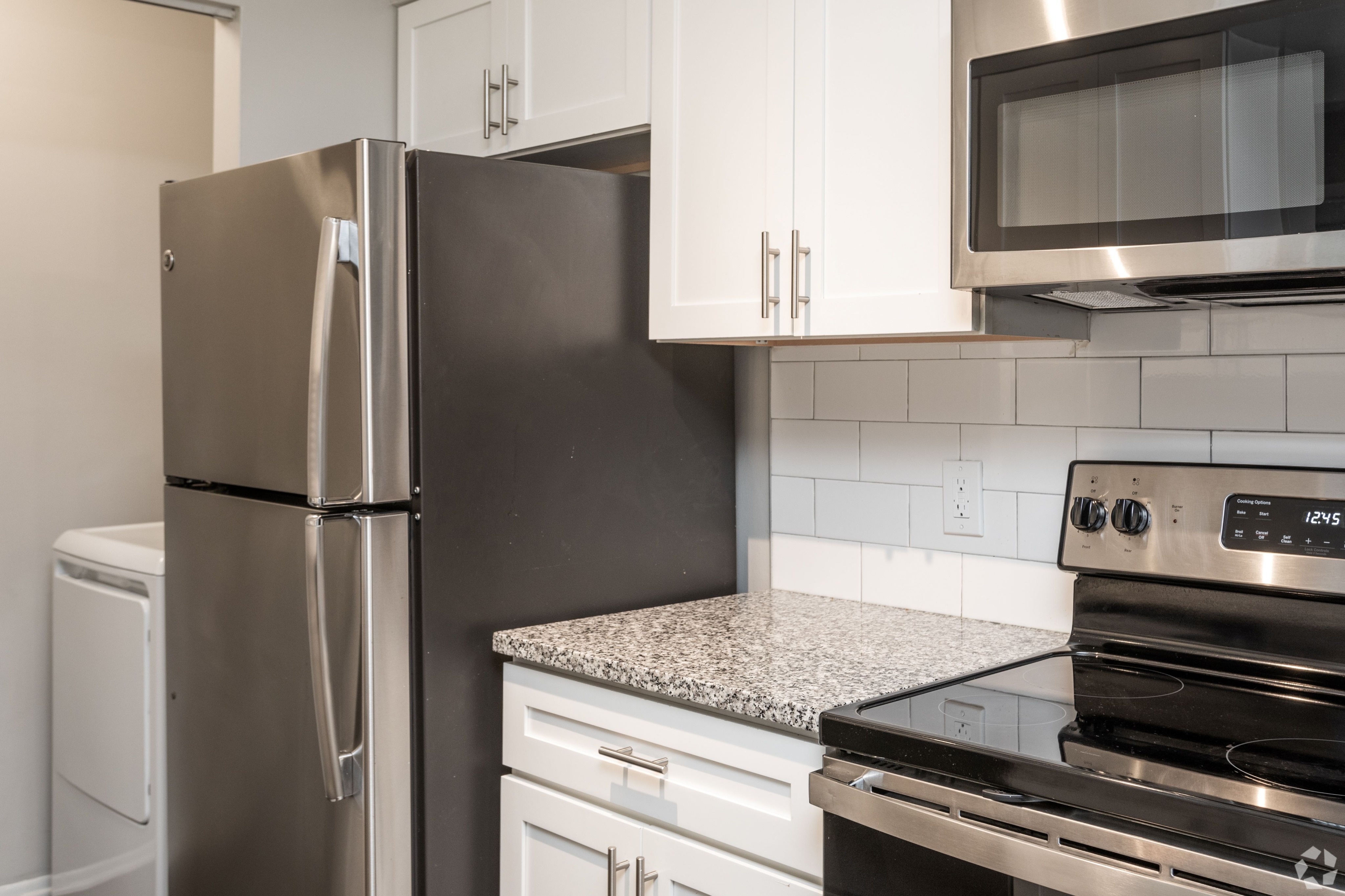 Upgraded Kitchen with Quartz Counters and Stainless Appliances in an Autumn Columbia apartment.