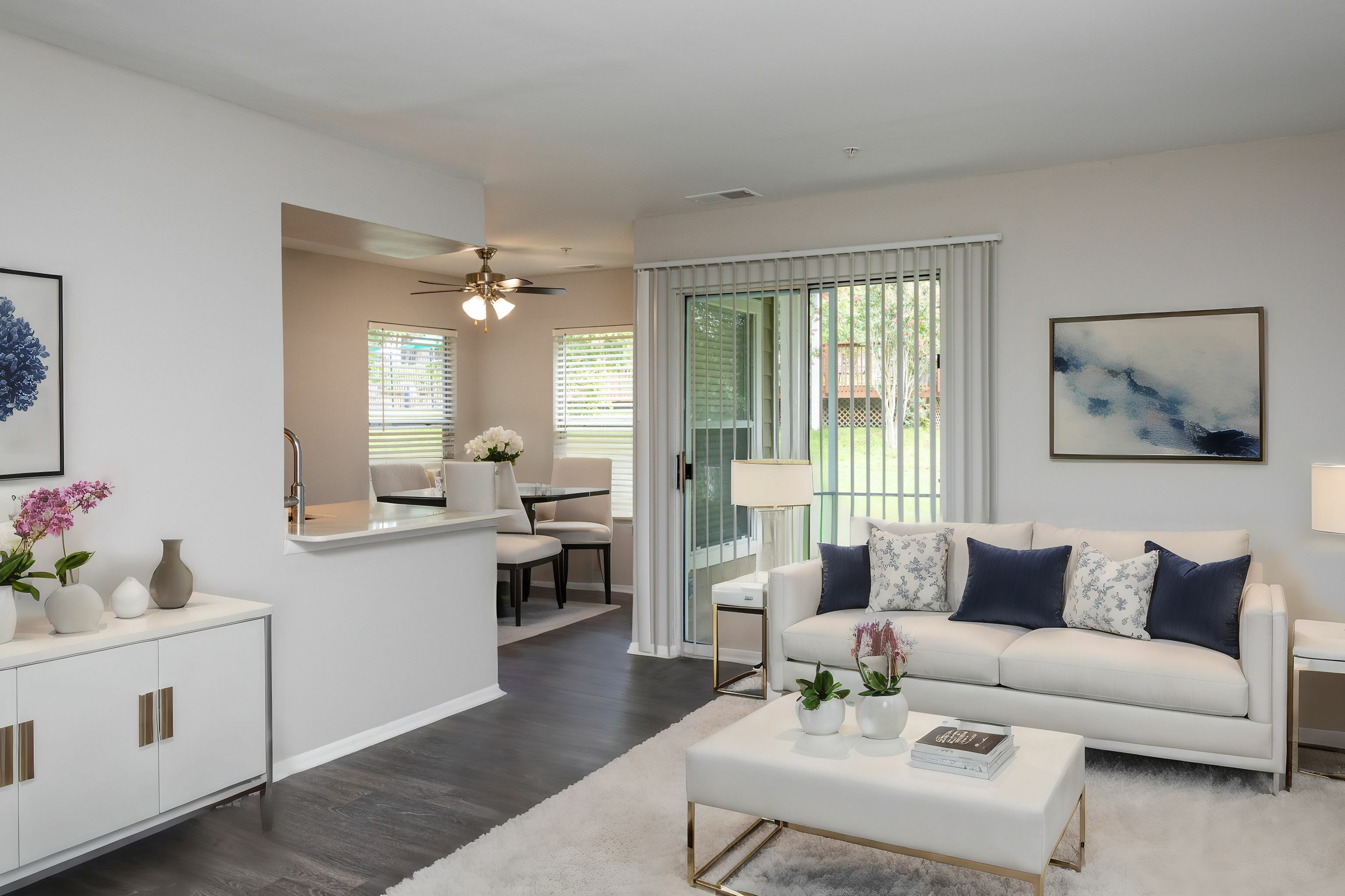 Large open floor plan with wood flooring throughout Countertops and White Cabinetry at Autumn Town Center Columbia apartments.