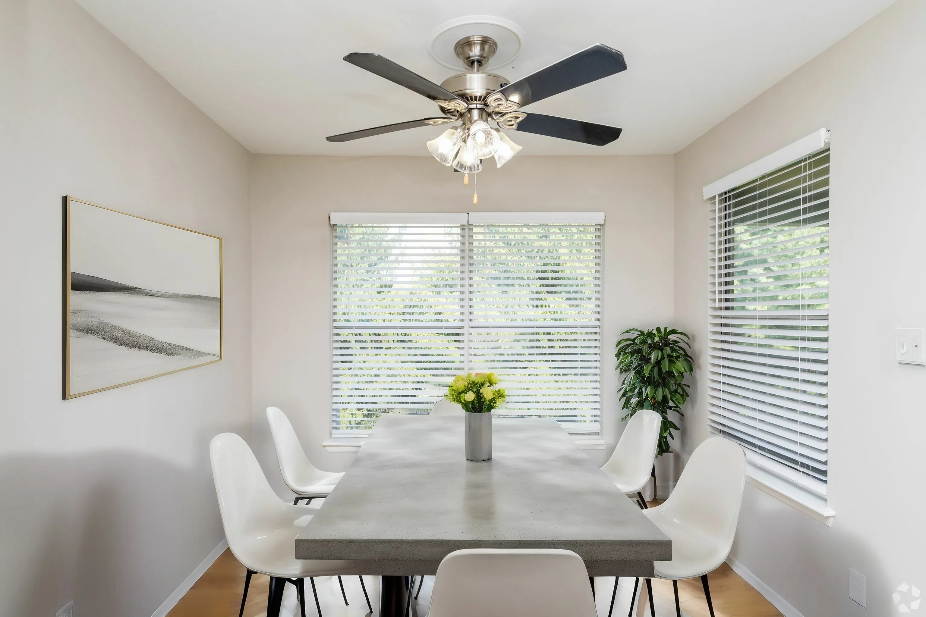 Spacious Dining Room next to Open Concept Kitchen in an Autumn Town Center apartment.