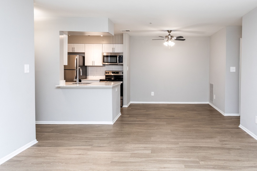 Luxurious Kitchen with Upgraded Stainless Appliances in an Autumn Town Center apartment.