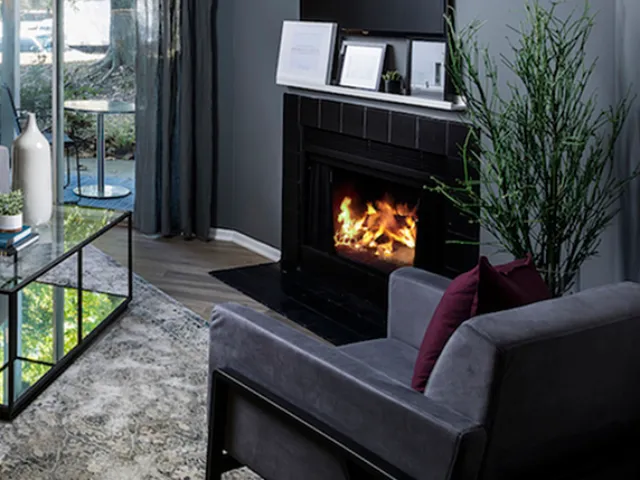 Oversized chair next to fireplace