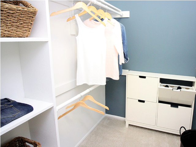 Walk in closet with custom cabinetry