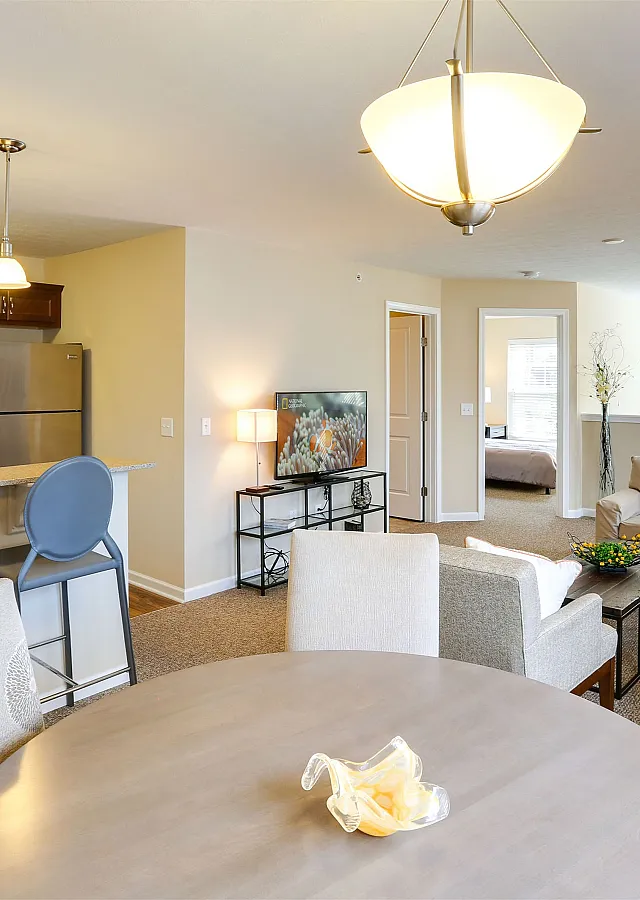 Bright and inviting open-concept living area with stylish kitchen, cozy seating, and ample natural light.