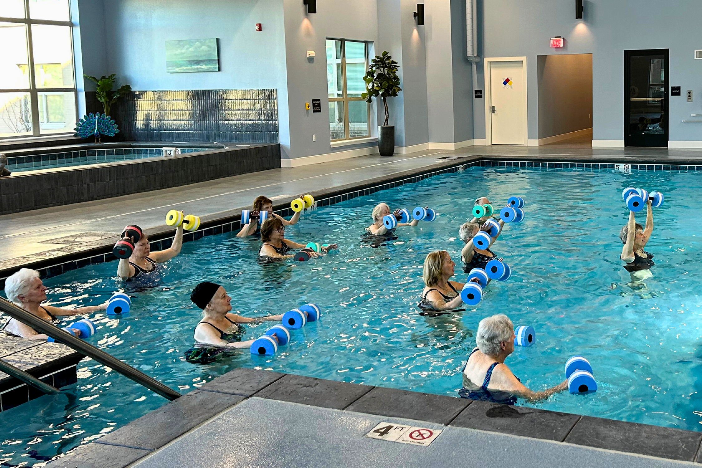 Residents Exercising in Indoor Pool | Attivo Trails Ankeny | Ankeny, Iowa
