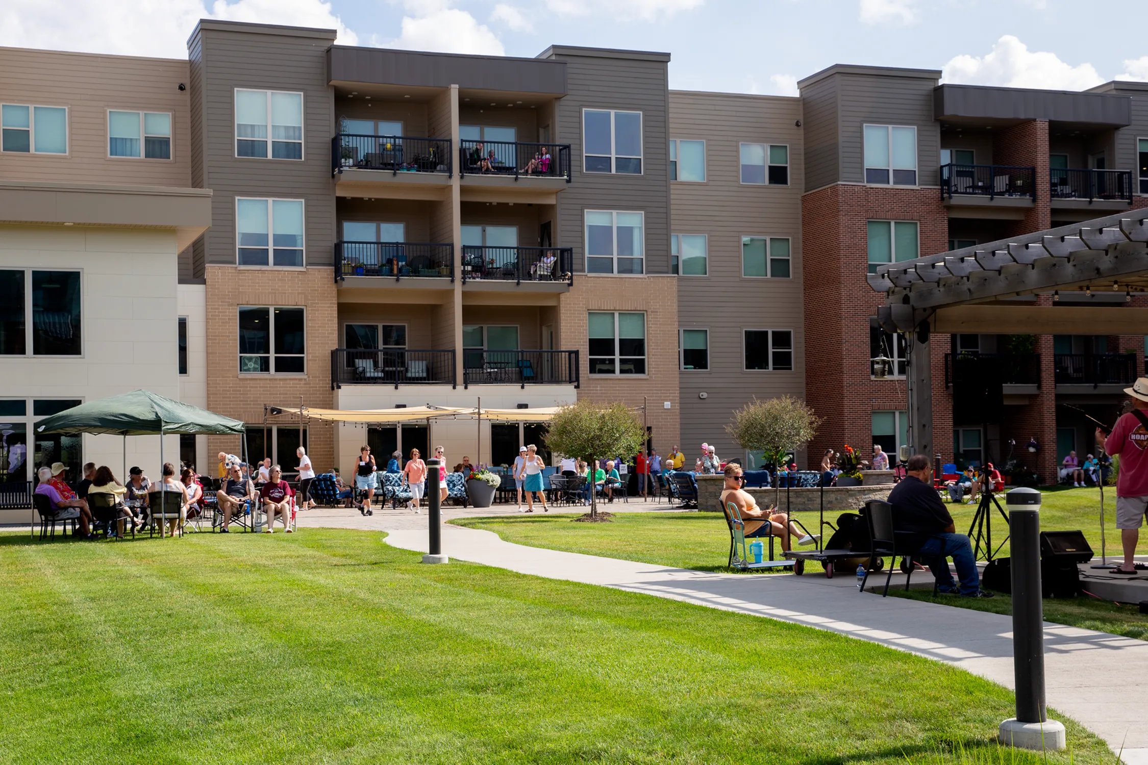 Residents Enjoying Outdoor Seatings | Attivo Trails Waukee | Waukee, Iowa
