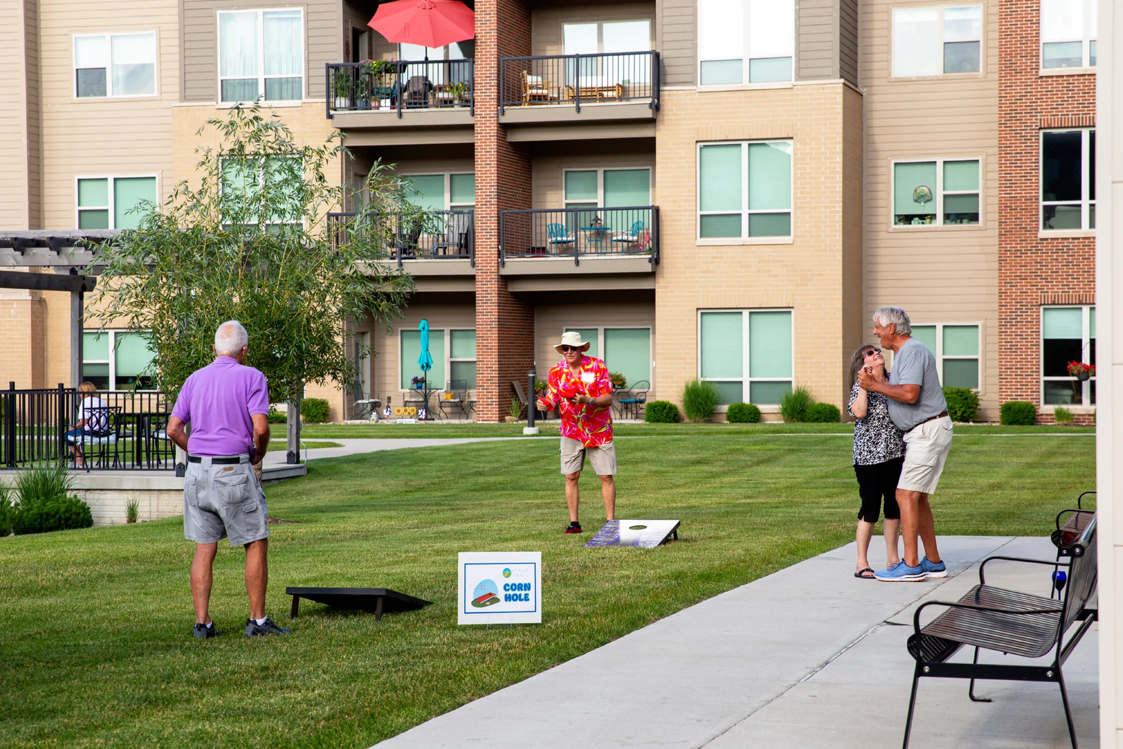 Residents Playing Cornhole | Attivo Trails Waukee | Waukee, Iowa