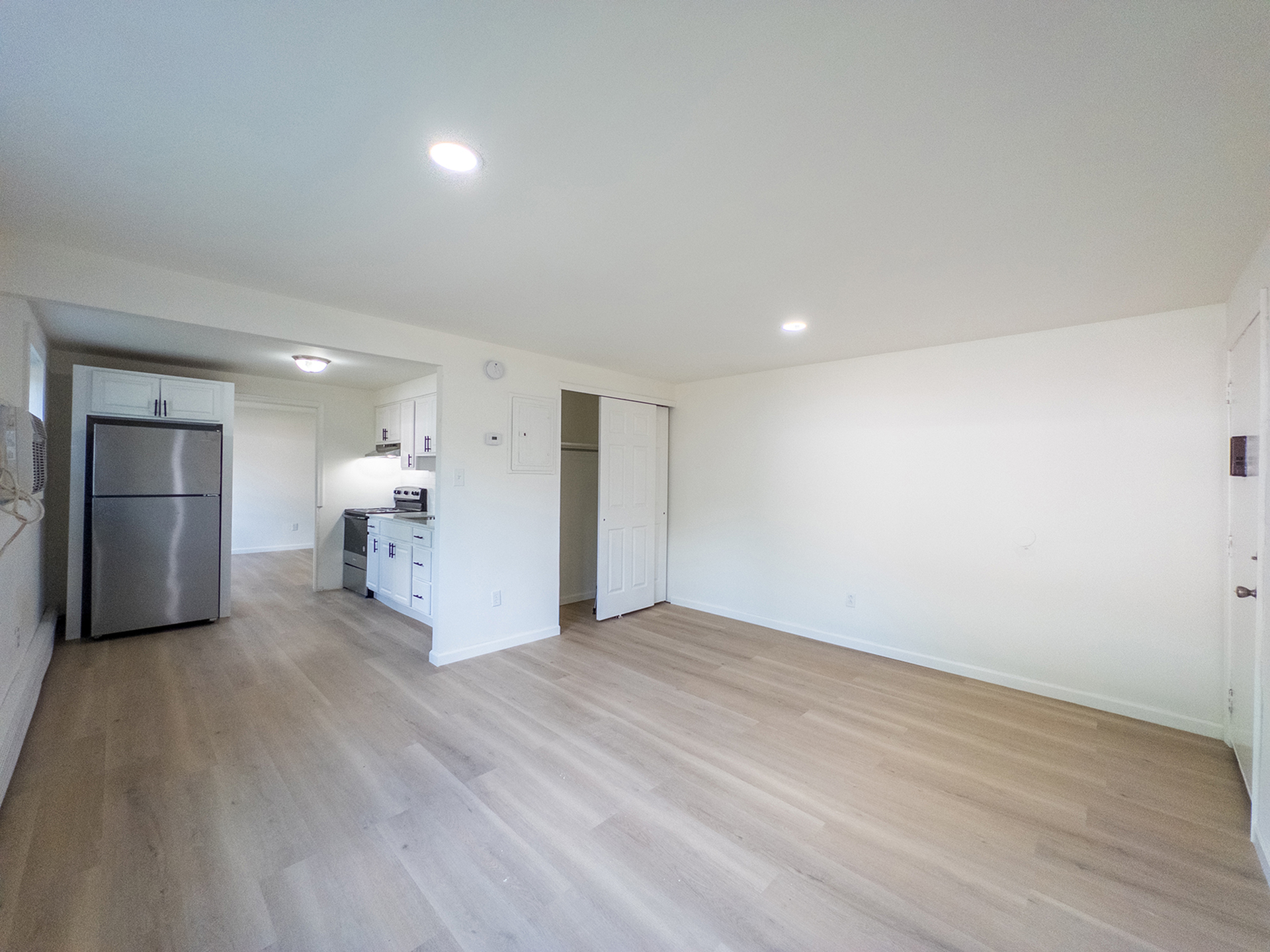 spacious living room with open kitchen