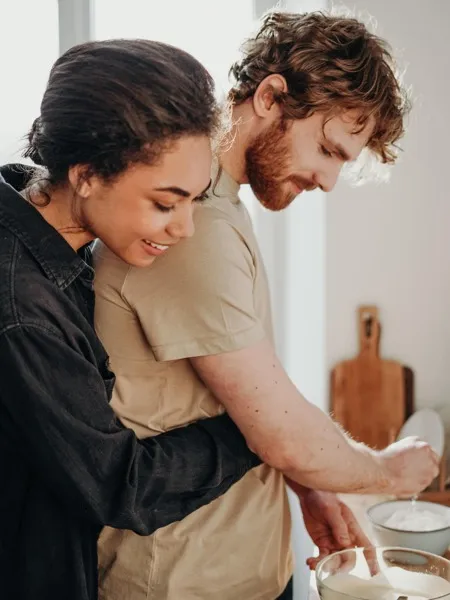 couple cooking in kitchen