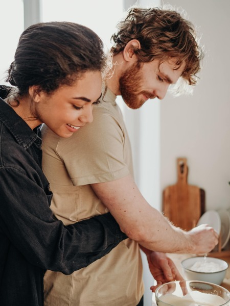 couple cooking in kitchen