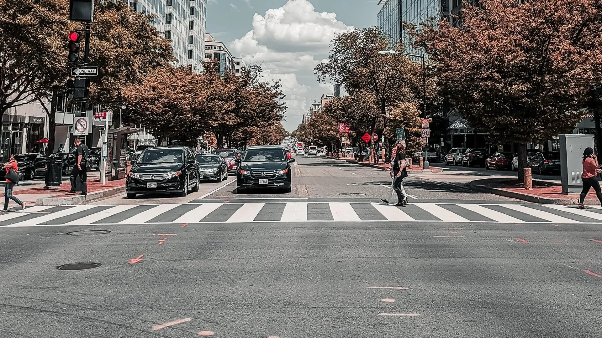 city intersection with people in crosswalk