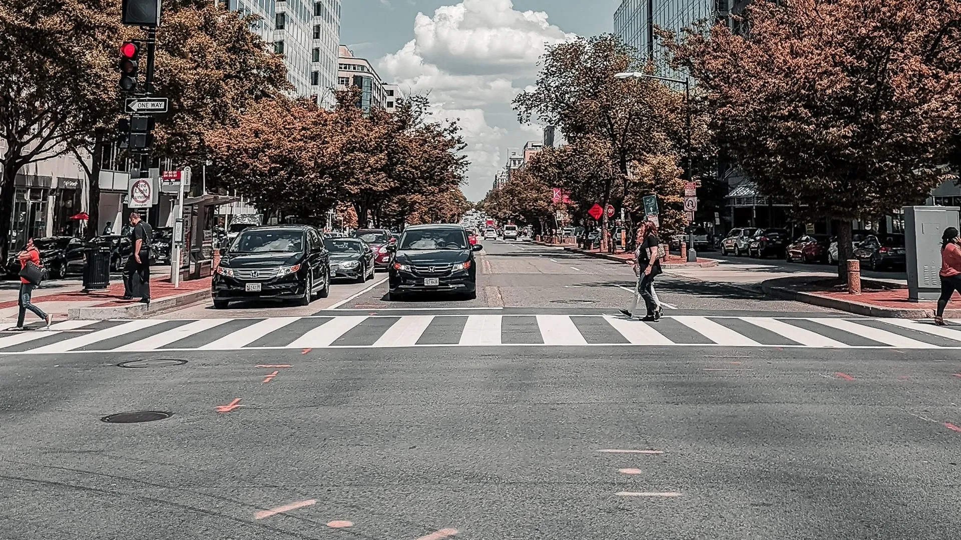 city intersection with people in crosswalk
