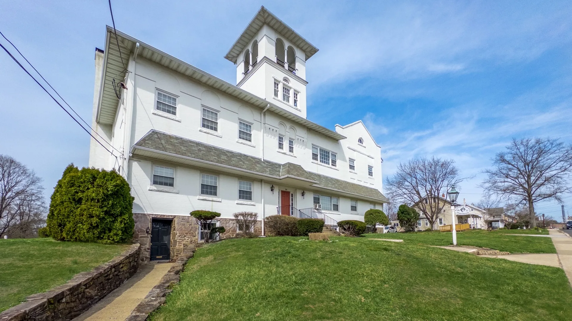 college court apartments, school house building, old white school house turned into apartments