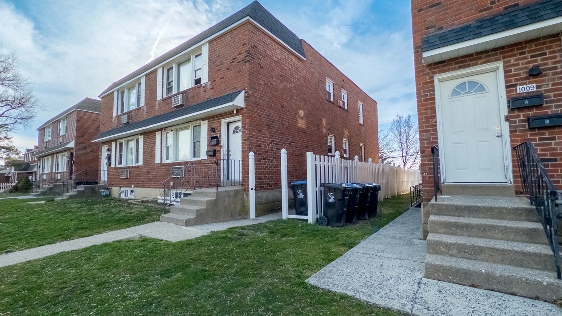 Townhomes on Cooke Lane, brick buildings with front lawns