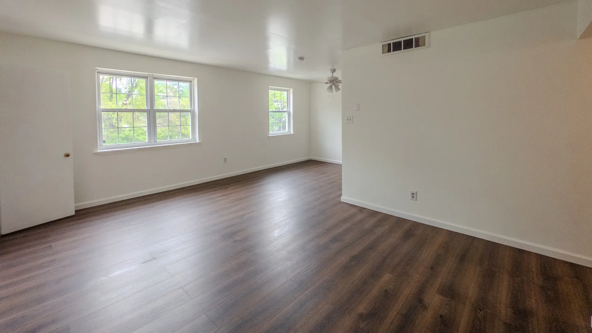 spacious living room with large windows