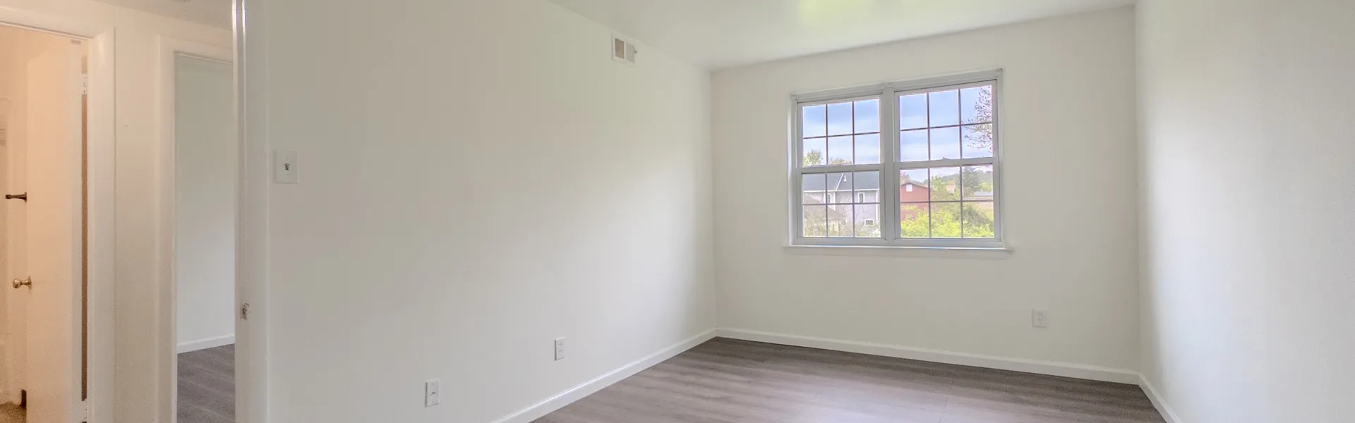 room with window and wood floor