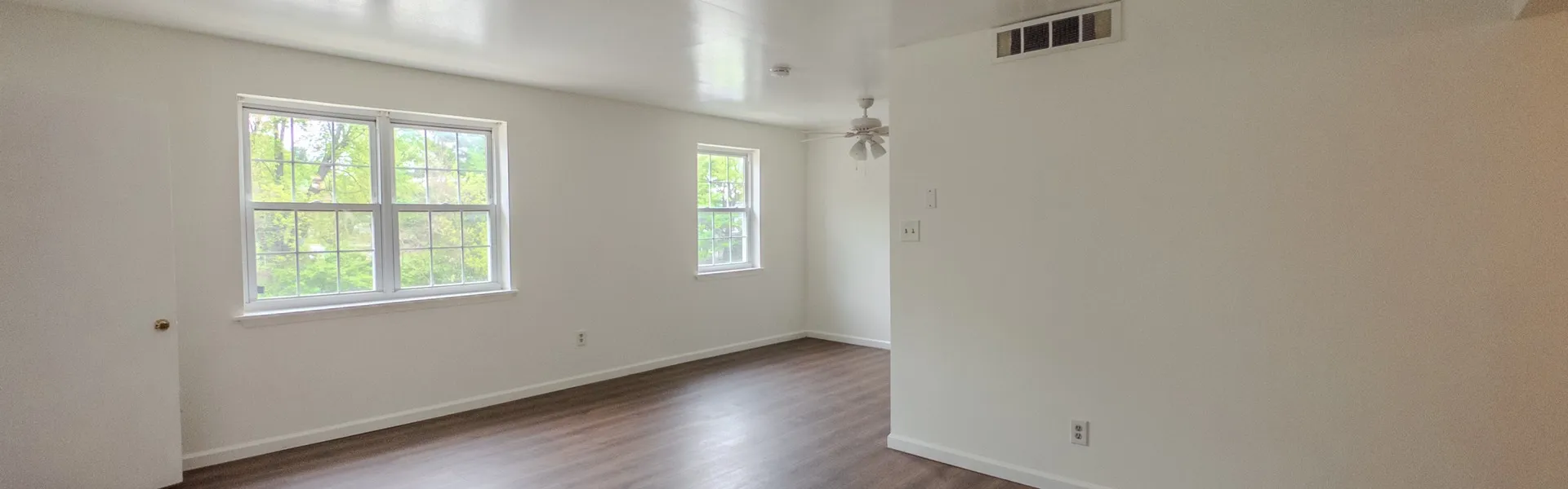 spacious living room with large windows