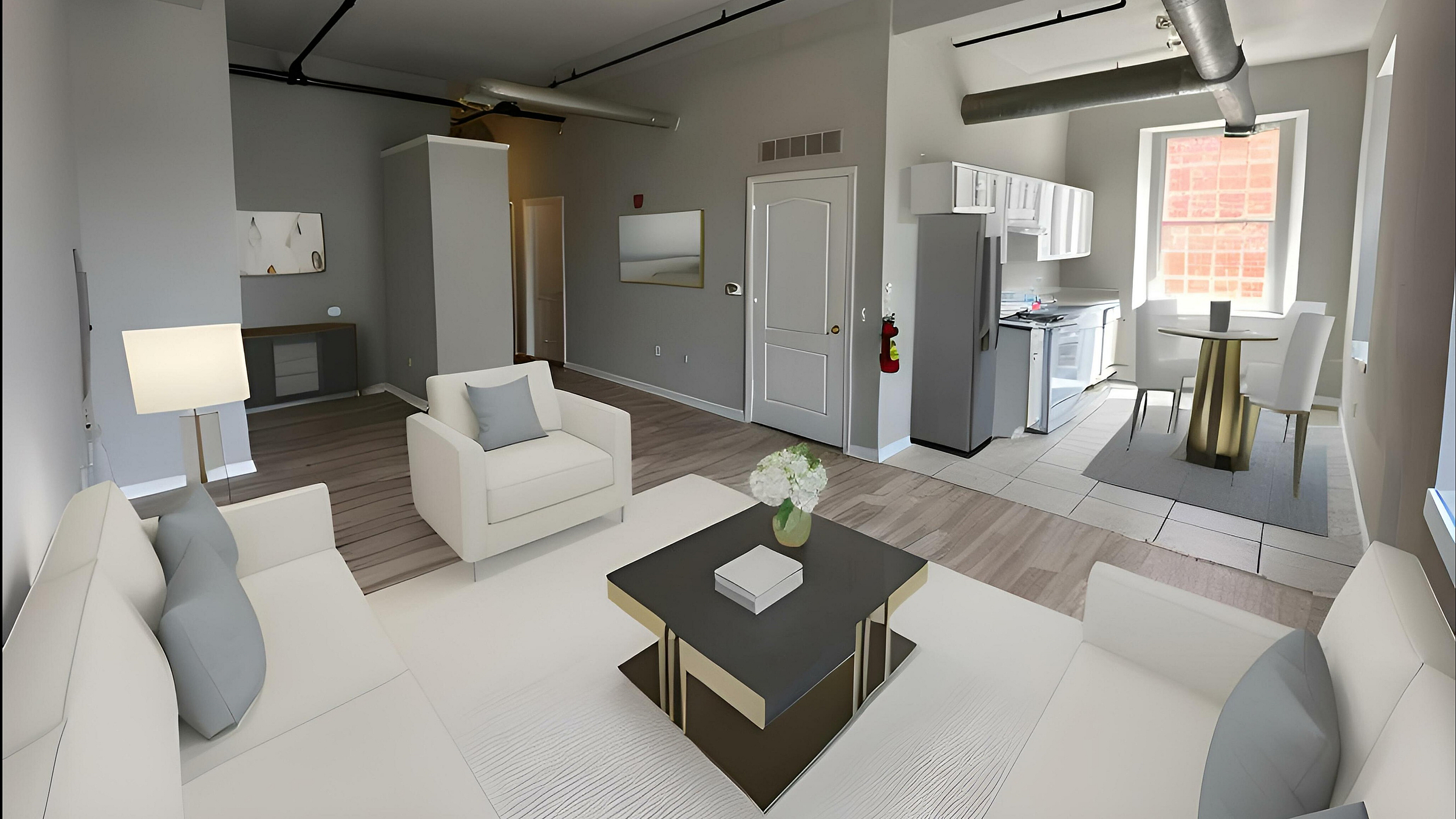 Modern open-concept living space featuring sleek kitchen, cozy dining area, and stylish seating in a contemporary loft setting.