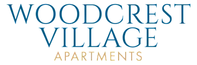 Elegant Woodcrest Village Apartments logo in sophisticated blue and gold typography.