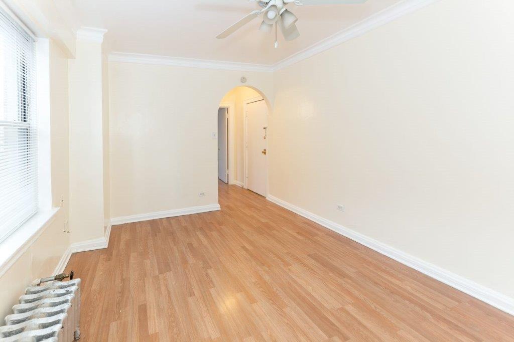 06 tier living room with hardwood floors and a neutral color palette.