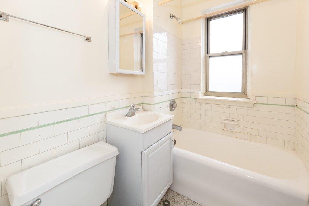 03 Bathroom with vanity and tub.