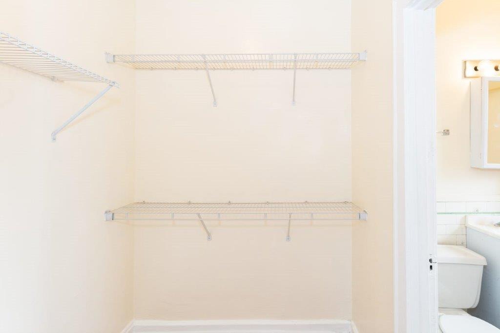 Great closet space with wire hanging brackets.
