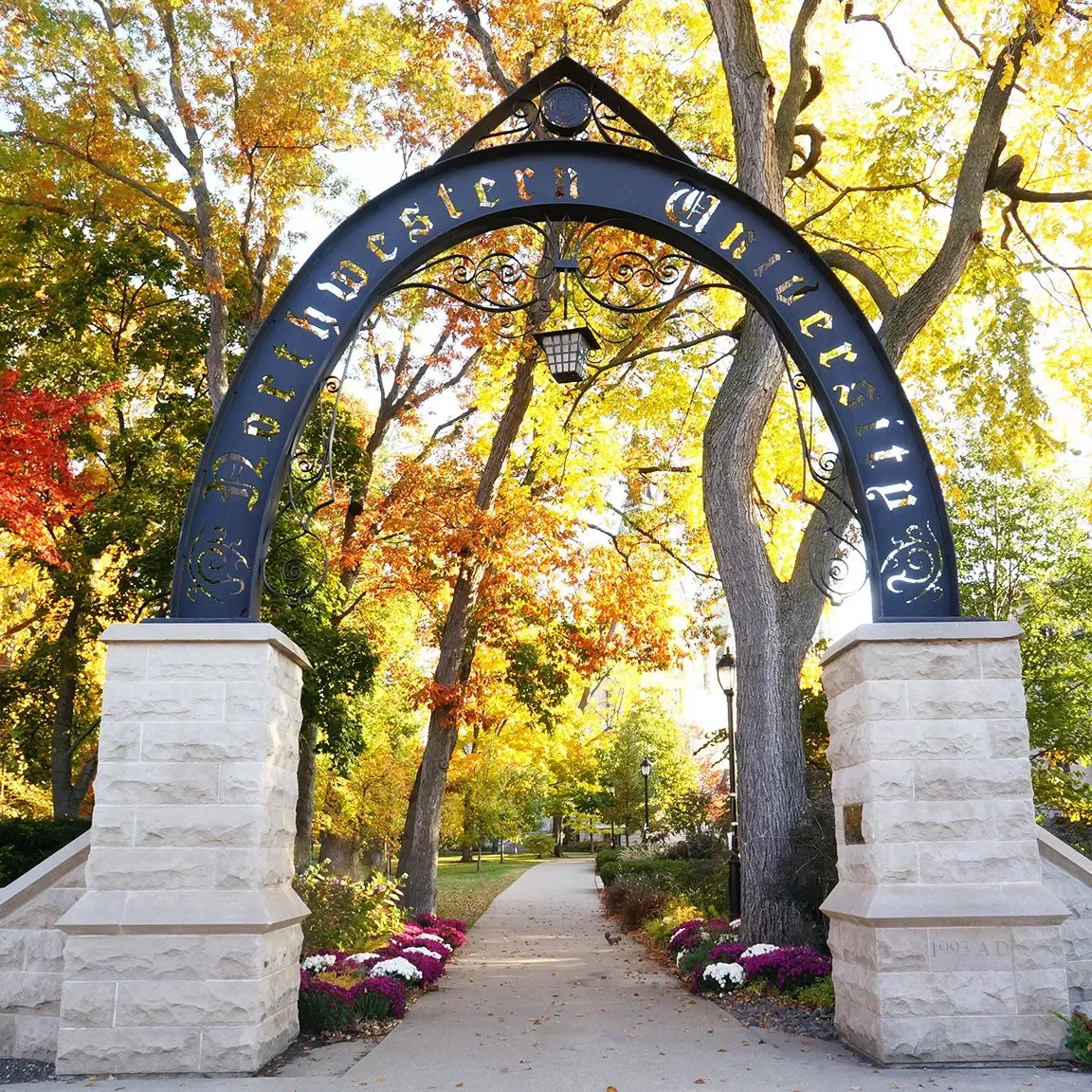 Northwestern University arched main gate on a colorful fall day.