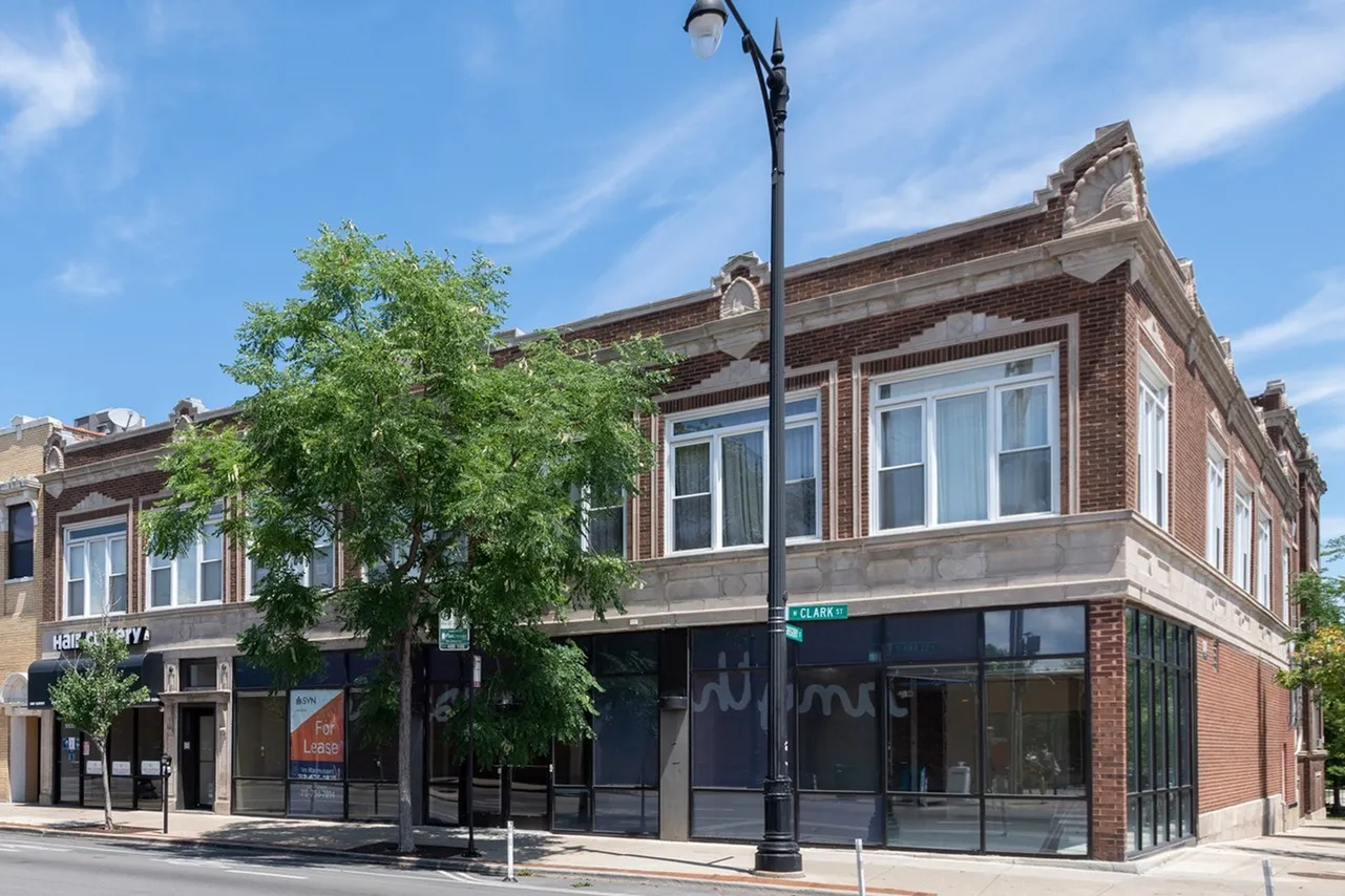 Exterior of 5531-39 North Clark Street a handsome two story vintage brick building with storefronts on the first floor in Andersonville.