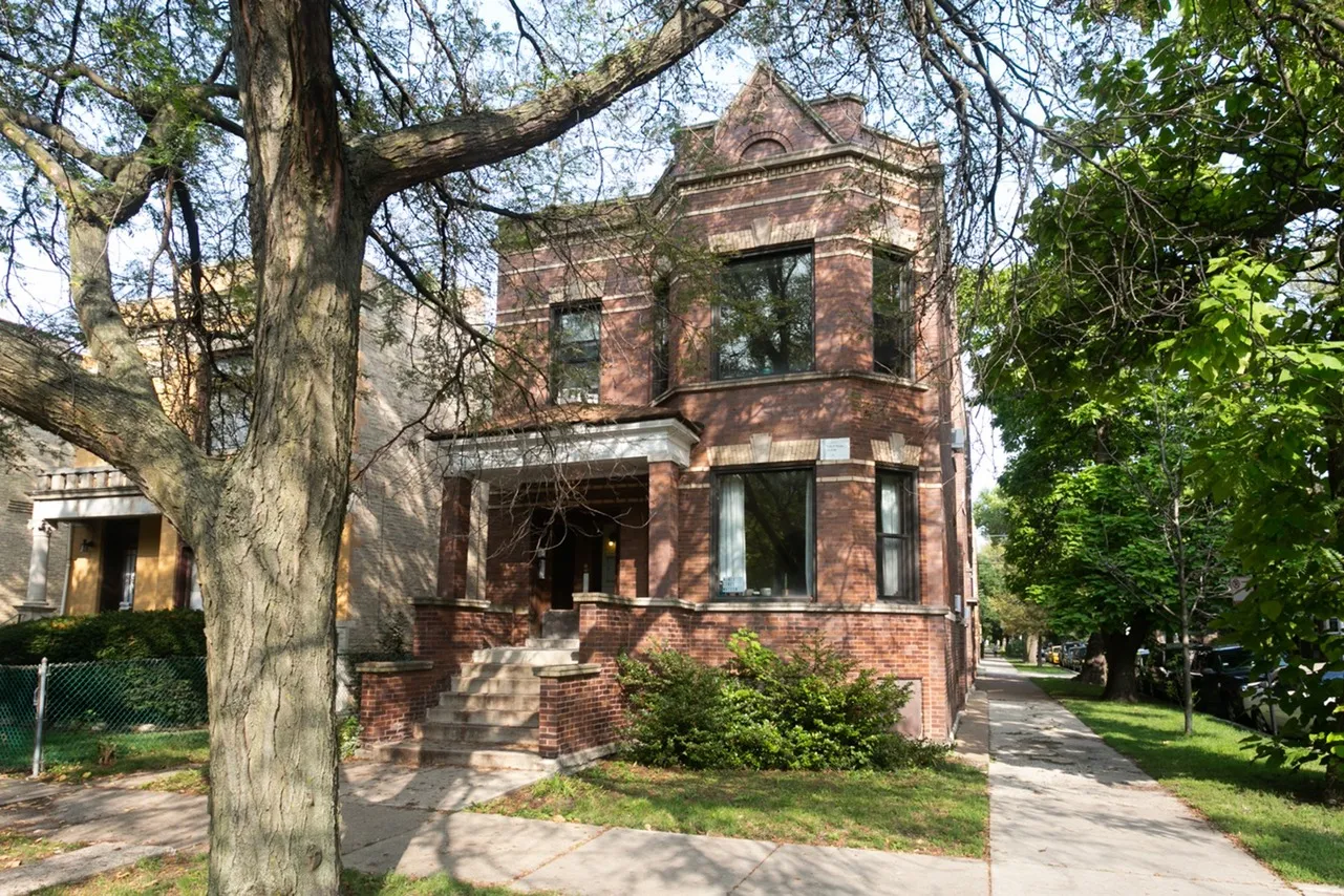 Exterior of Troy and Schubert a six unit two story red brick property in Logan Square