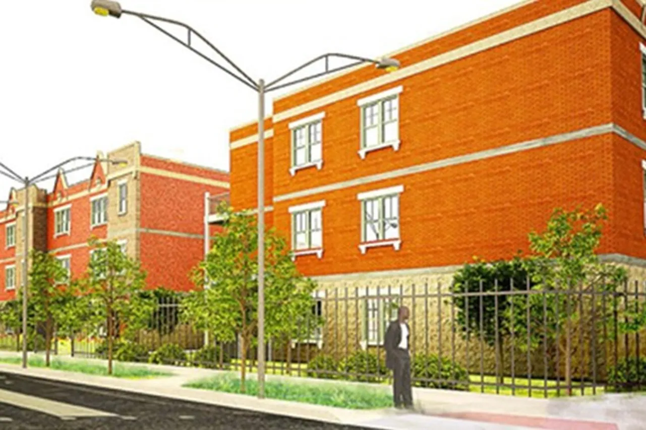 Exterior of Harvest Homes a 36 unit three story red brick income restricted property with limestone accents in Garfield Park.