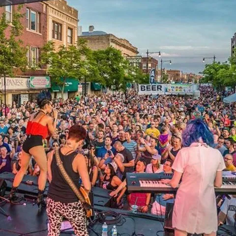 Midsommarfest in Andersonville.  A festival with hundreds of people in the street listening to a live band.