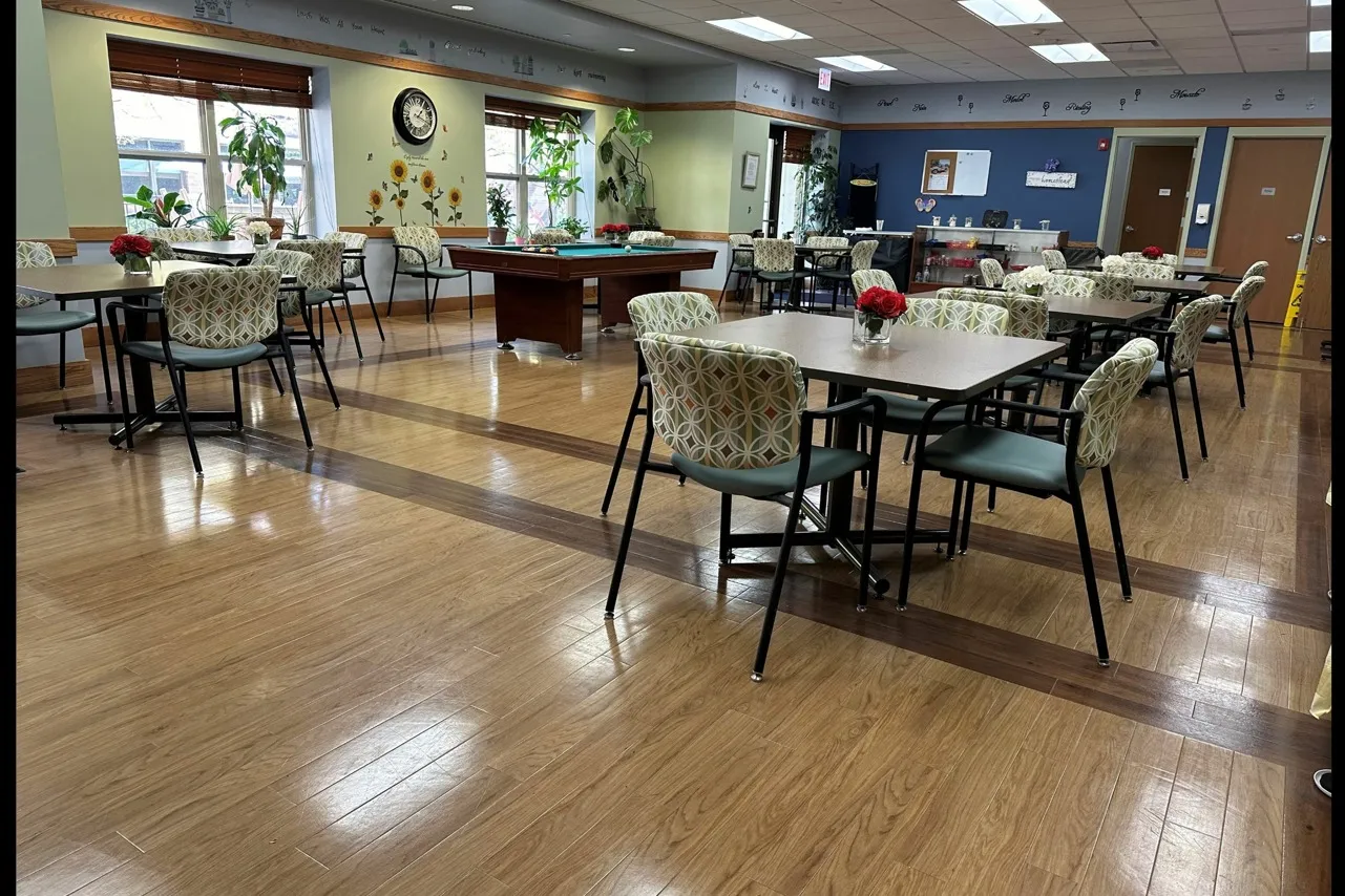 Nicely appointed community room with a billiards table and card table.