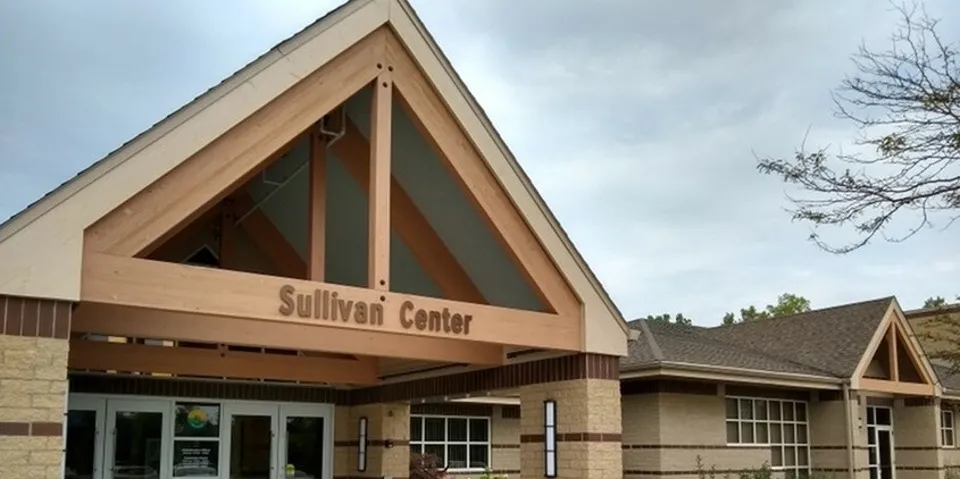 The peaked roof and signage for the Sullivan Center Park District Facility.