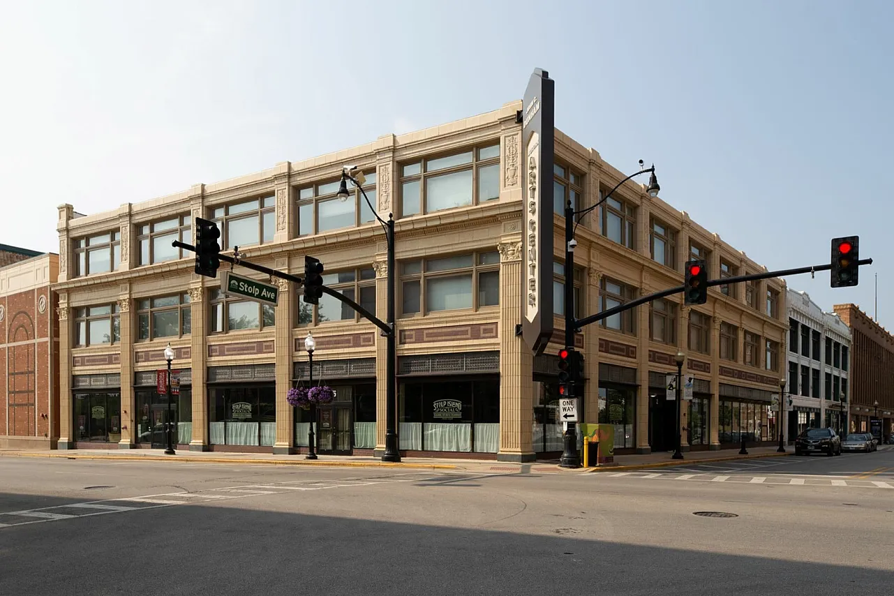 Exterior of Artesan Lofts a thirty eight unit three story historic brick apartment building with commercial first floor in Aurora.