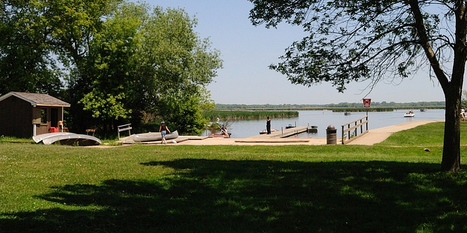 Lakefront with docks canoes and mature trees