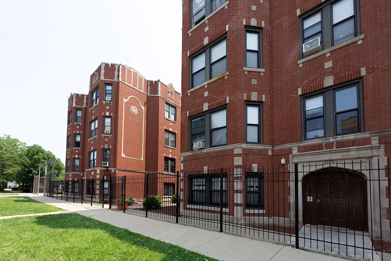 3625 West Dickens a sixty unit red brick courtyard building with landscaped grounds.