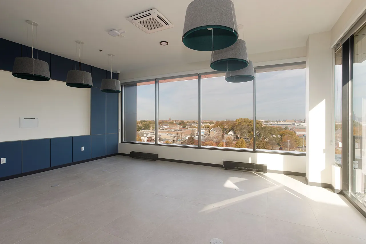 6th floor party room looking out of the windows with a blue accent wall